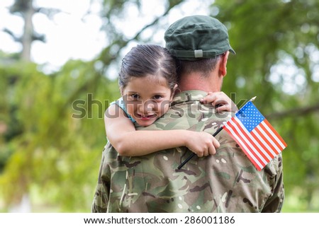 Soldier reunited with his daughter on a sunny day