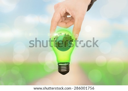 Businessman measuring something with his fingers against yellow abstract light spot design