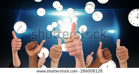 Hands showing thumbs up against digitally generated floating clock pattern
