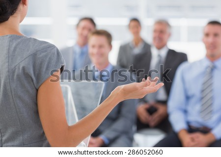 Businesswoman doing conference presentation in meeting room