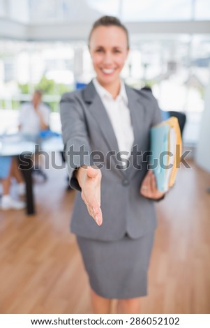 Smiling businesswoman introducing herself in medical office