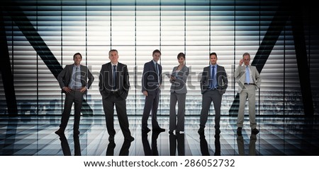 Business people against room with large window looking on city