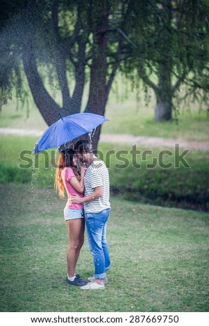 young people in the park on the raining day