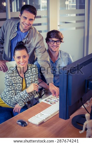 Happy designers working together in creative office