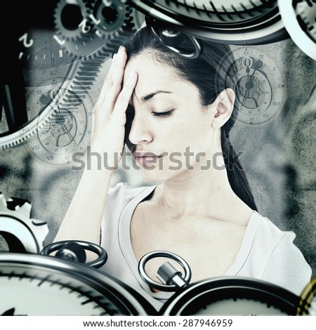 Sad woman hiding her face against grey background