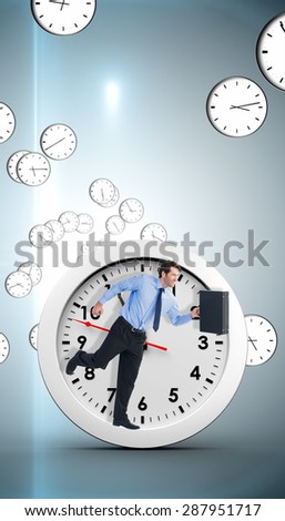 Walking and smiling businessman with suitcase against digitally generated floating clock pattern