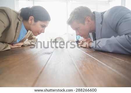 Business partners watching crystal ball in an office
