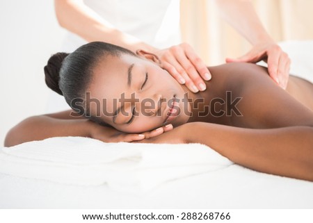 Pretty woman enjoying a massage at the health spa
