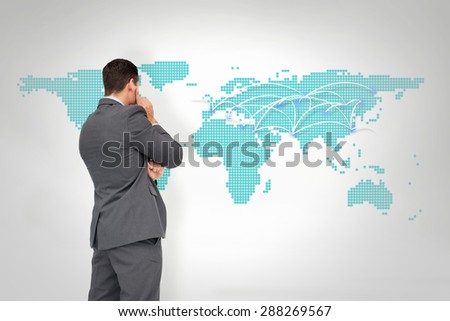 Thinking businessman against world map