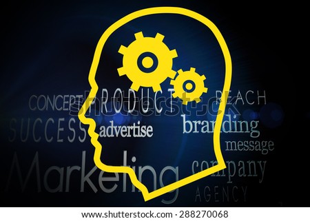 Cogs in head against marketing words on black background