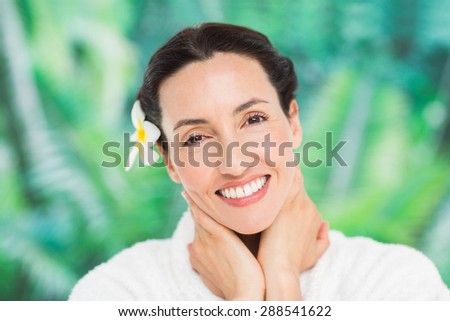 a woman with a flower in her hair on a spa day