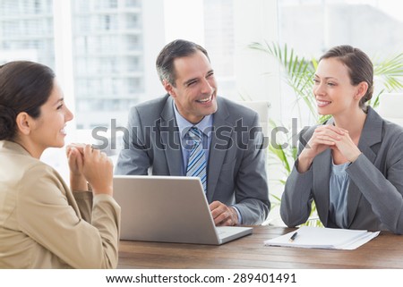 Business people conducting an interview in an office