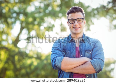 Happy hipster looking at camera on a sunny day
