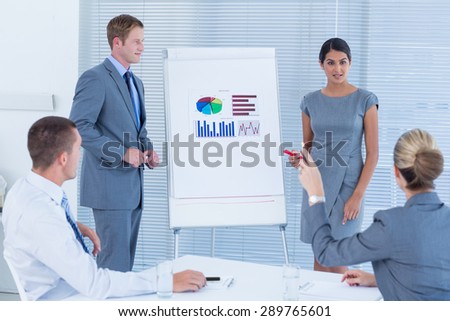 Business people doing statistics presentation in the office