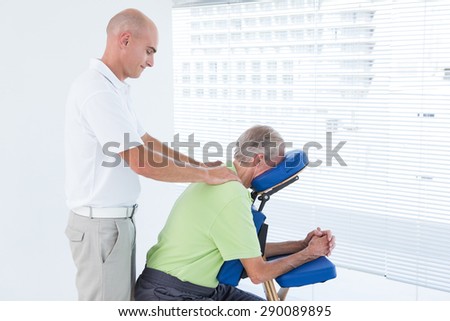 Man having back massage in medical office