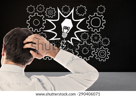 Businessman scratching his head against black room
