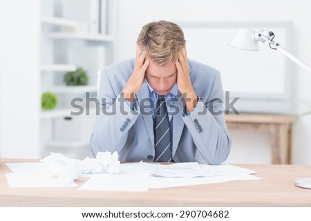 Businessman being depressed by working in office