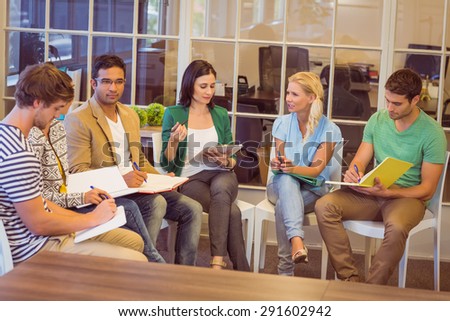 Attentive creative business people in meeting at office