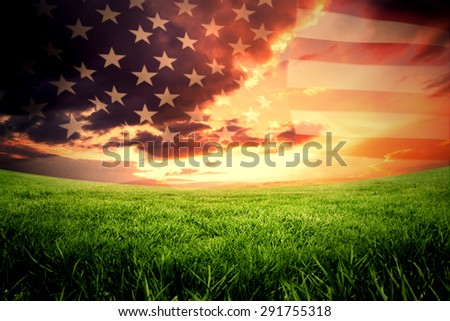 United states of america flag against green field under orange sky