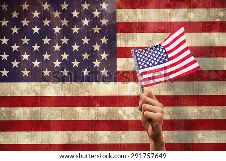 Hand waving american flag against usa flag in grunge effect