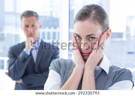 Businesswoman with hands on her face in the office