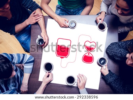 People sitting around table drinking coffee against blood donation