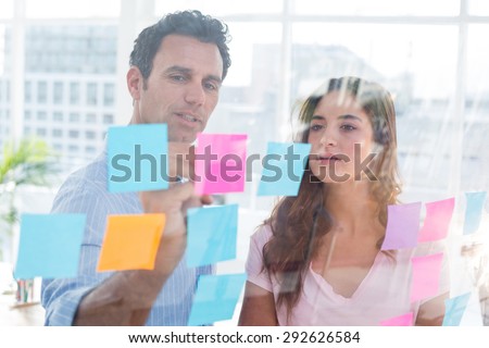 Young creative business people writing photo editor at office