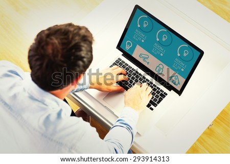 Man using laptop against home automation system