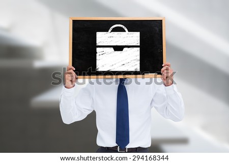 Businessman showing board against white staircase in a home