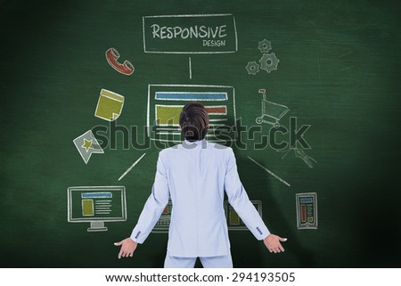 Standing businessman against green chalkboard Standing businessman on white background