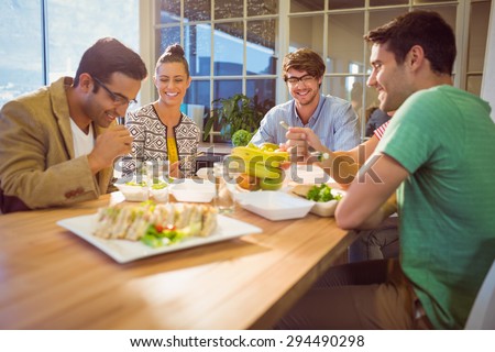 Young business people having lunch together