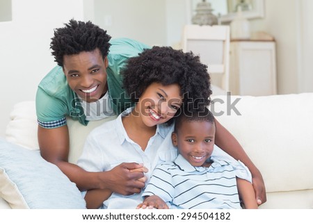 Happy family on the couch at home in the living room