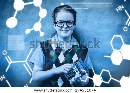 Science graphic against portrait of cute little girl holding calculator