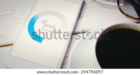 Loading screen against smartphone on desk
