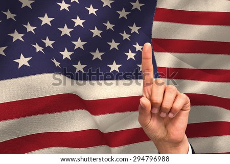 Hand pointing against united states of america flag