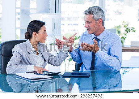 Business people having argument in office