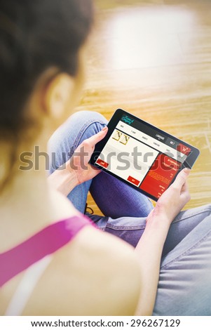 Woman using tablet at home against website design