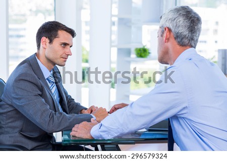 Business people speaking together in office