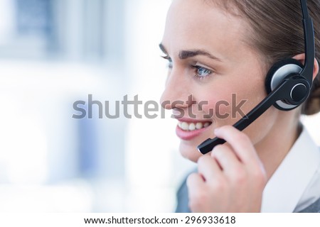 Close up view of happy businesswoman with headset in call center