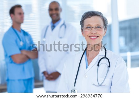 Portrait of smiling colleagues doctors looking at the camera