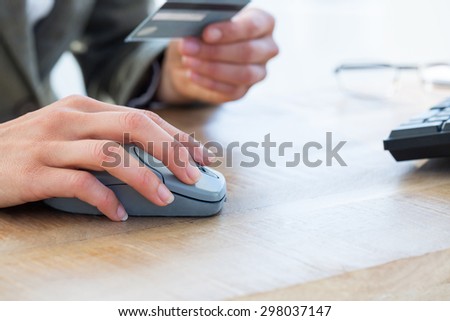 Businessman pay with credit card on internet on the office