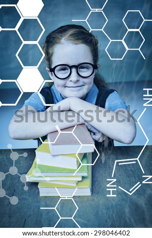 Science graphic against cute girl with stack of books in classroom