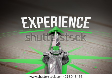 The word experience and compass against brown wooden background