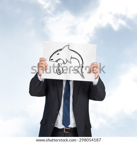 Mature businessman showing card against blue sky