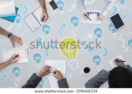 Business meeting against light bulb pattern
