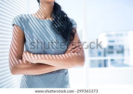 Close up view of businesswoman with arms folded in the office