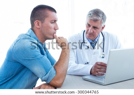 Worried patient with his doctor in medical office