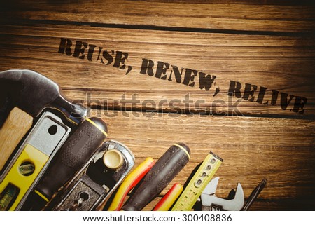 The word reuse, renew, relive against tools on desk