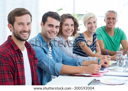 Portrait of creative business people in meeting at office
