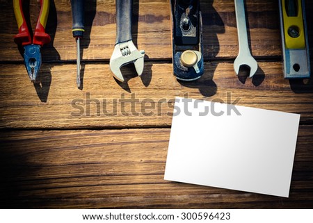 White card against desk with tools